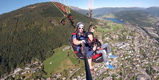 Top things to do in Voss: Paragliding gives you views above age old fjords, and the beautiful city of Voss