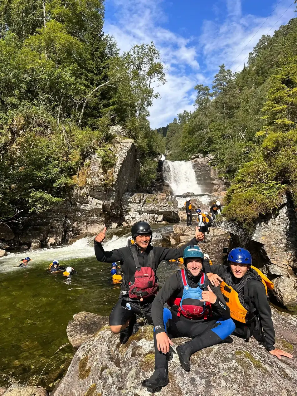Outdoor Norway Team Having Fun Near Waterfall